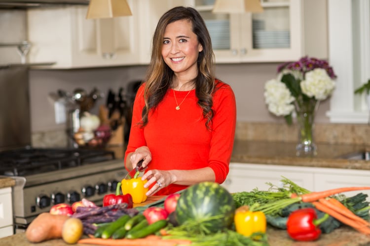 Brie chopping vegetables in the kitchen