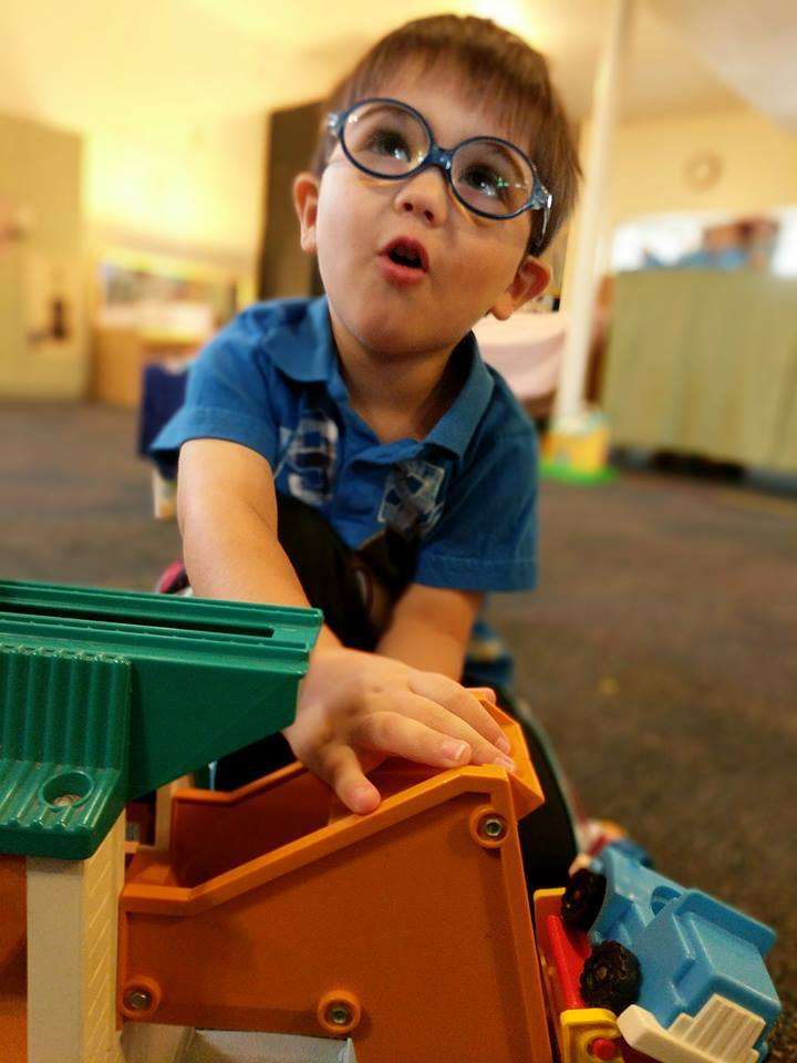 An early learner in a moment of discovery in a South Seattle Cooperative Preschool Toddler Class.