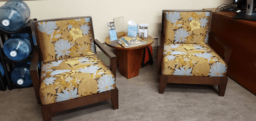 This area with the chairs and coffee table has since been transformed into a welcoming space with benches and a coat rack.&nbsp;&nbsp;