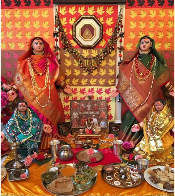 Goddess Gauri dolls and the food offerings