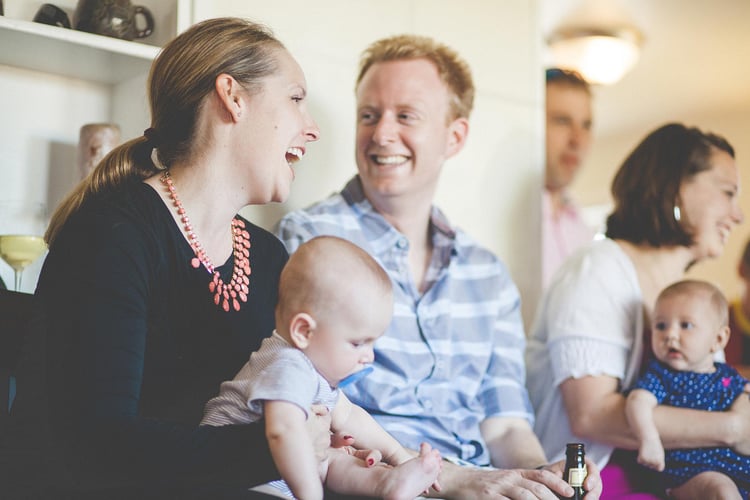 New parents laughing