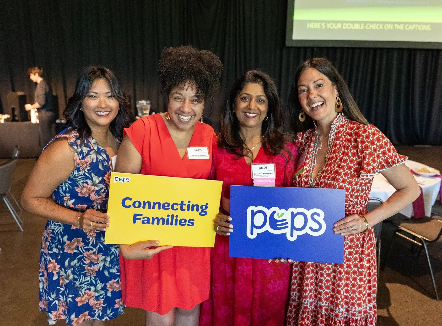 Our Model - PEPS staff and supporters at an event.