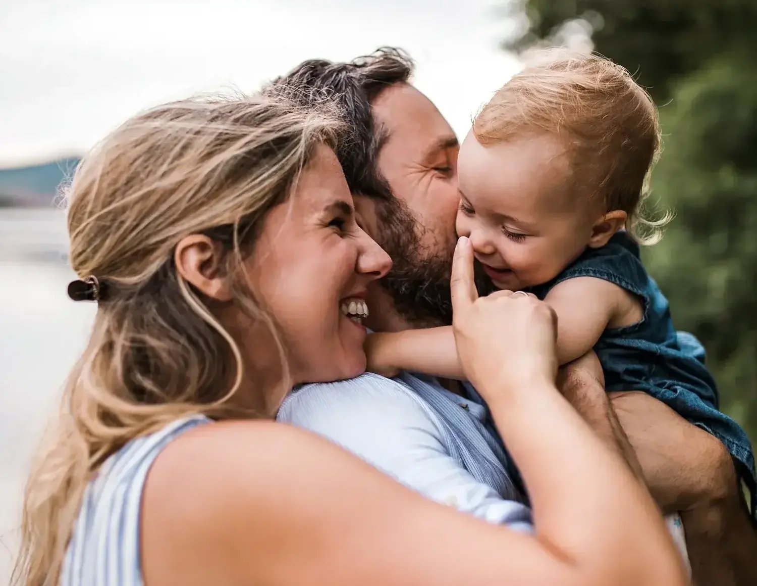 Two PEPS parents with their young child.